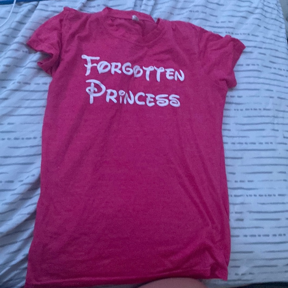a t-shirt words on front “forgotten princess